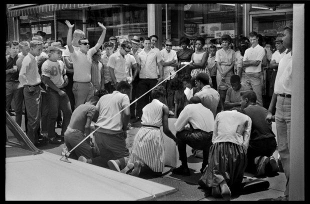 Demonstrators gather on a sidewalk under the taunts of whites on June 15, 1963. (Photo by Anthony Falletta)